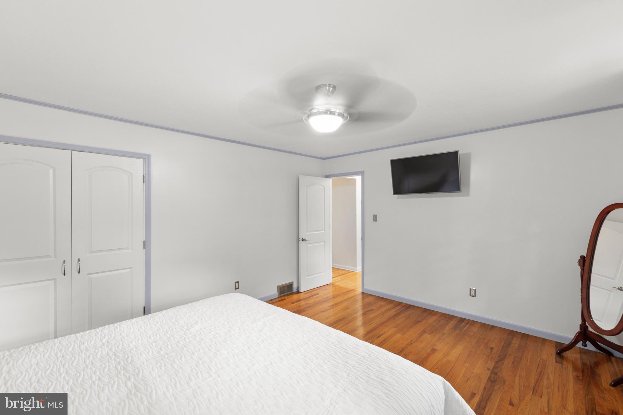 411 Rest Church Road Winchester, VA 22603 - Photo 21 of 46 Bright and airy bedroom with modern touches.