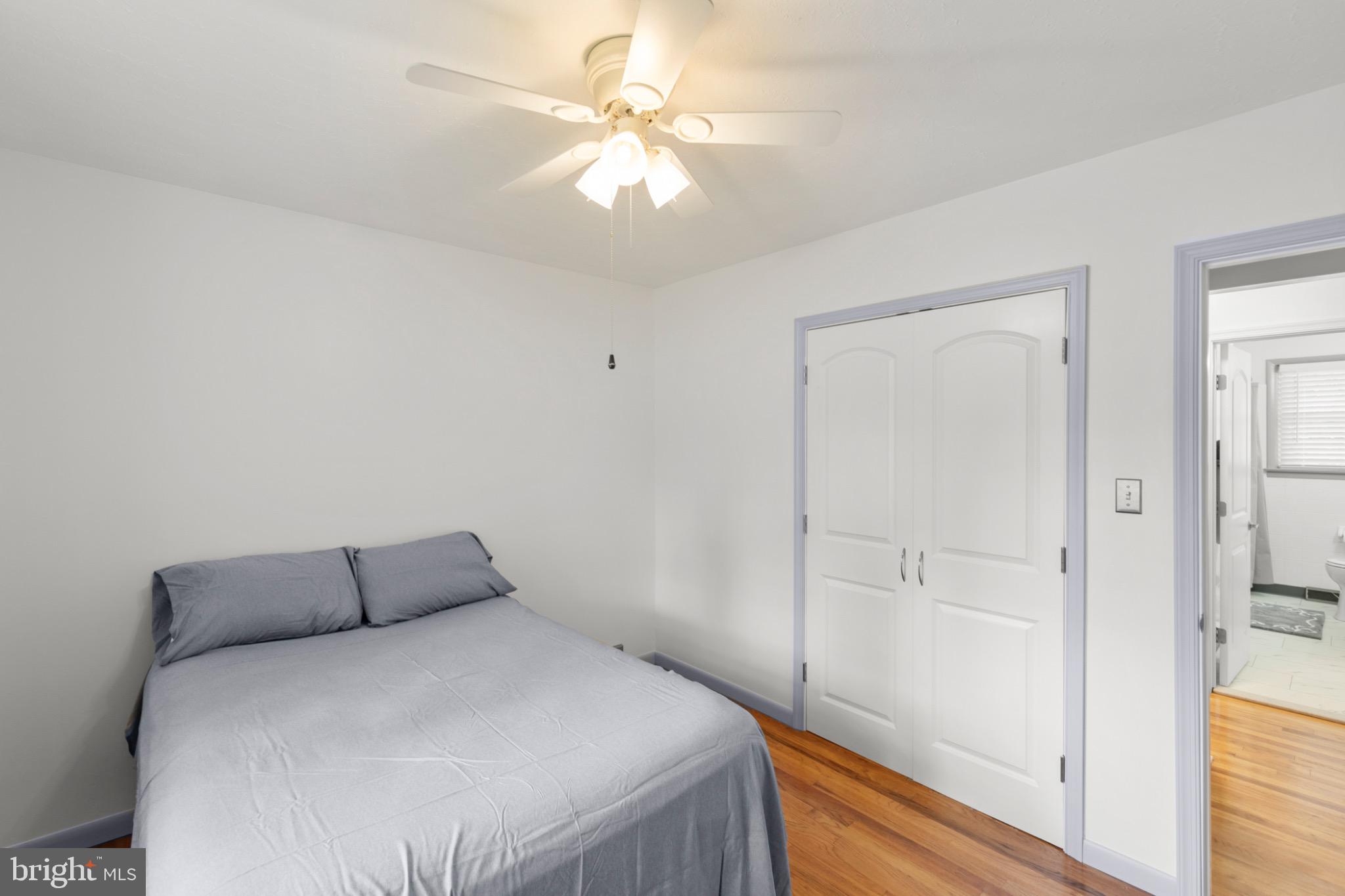 411 Rest Church Road Winchester, VA 22603 - Photo 27 of 46 Cozy bedroom with modern charm and light.