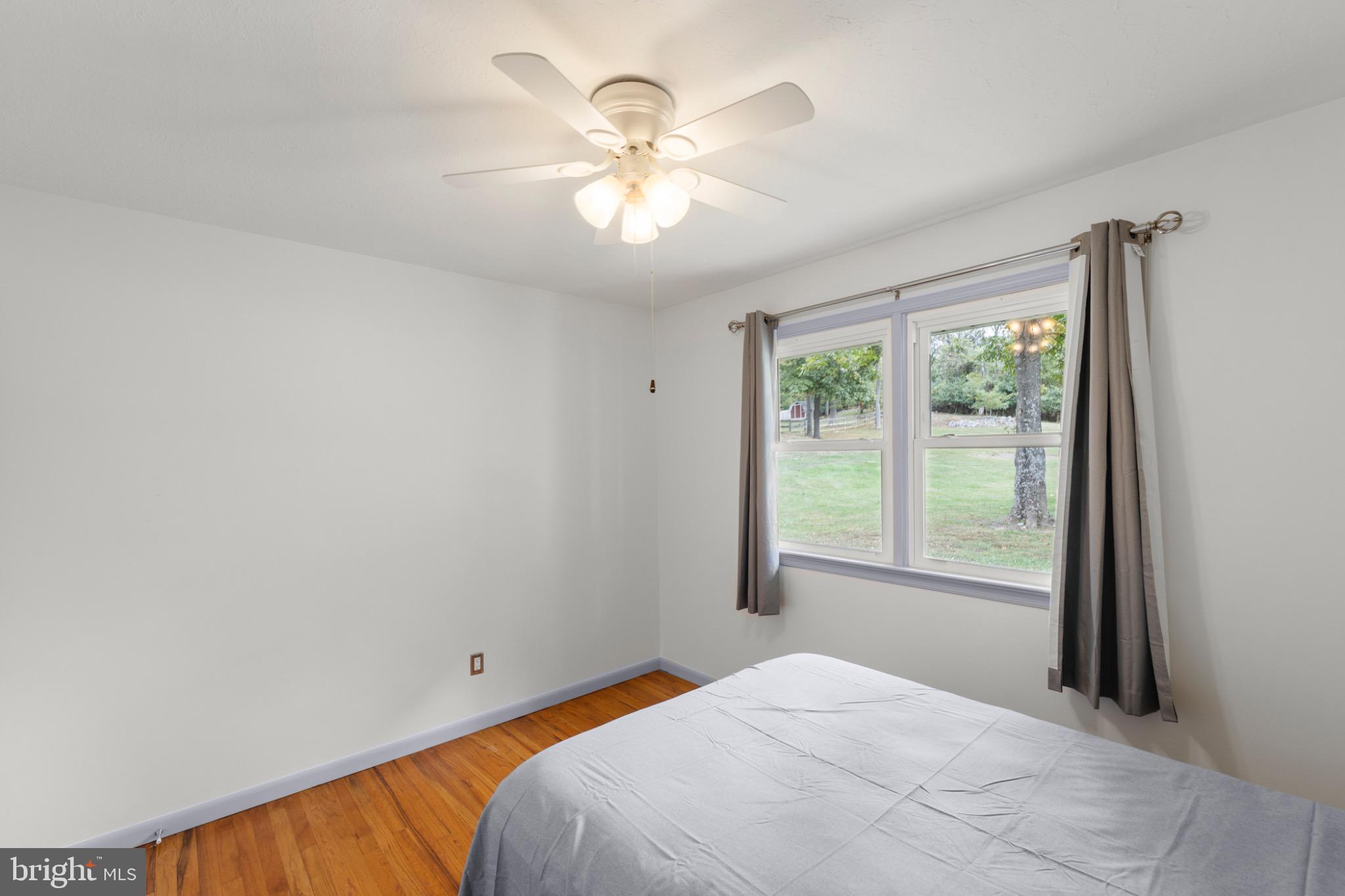 411 Rest Church Road Winchester, VA 22603 - Photo 28 of 46 Bright and airy bedroom with scenic views.