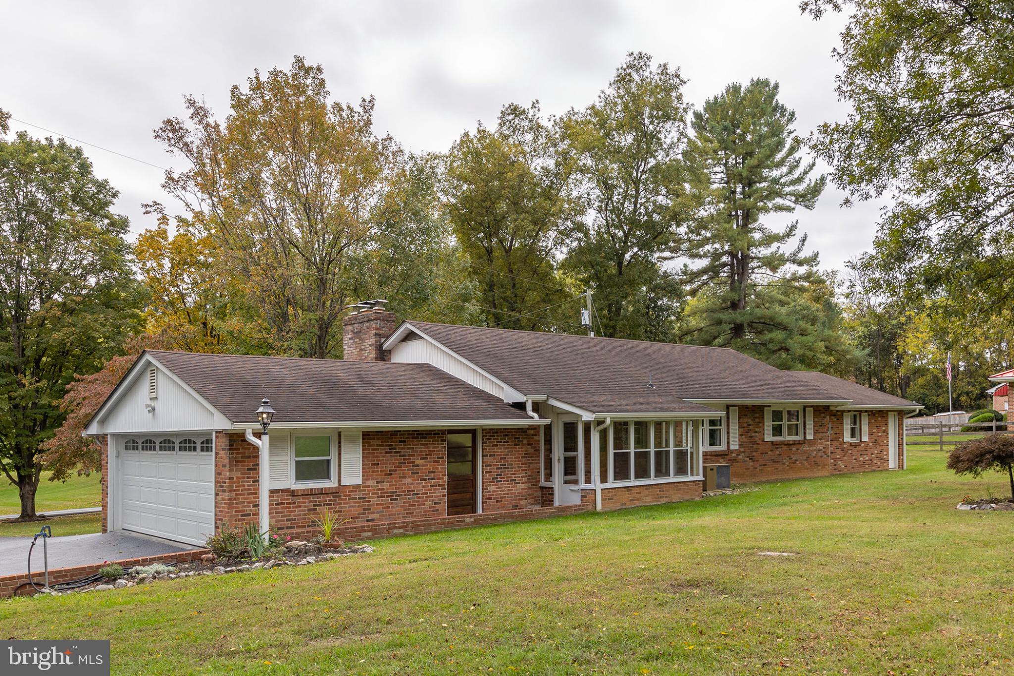 411 Rest Church Road Winchester, VA 22603 - Photo 4 of 46 Charming brick home nestled in nature's embrace.