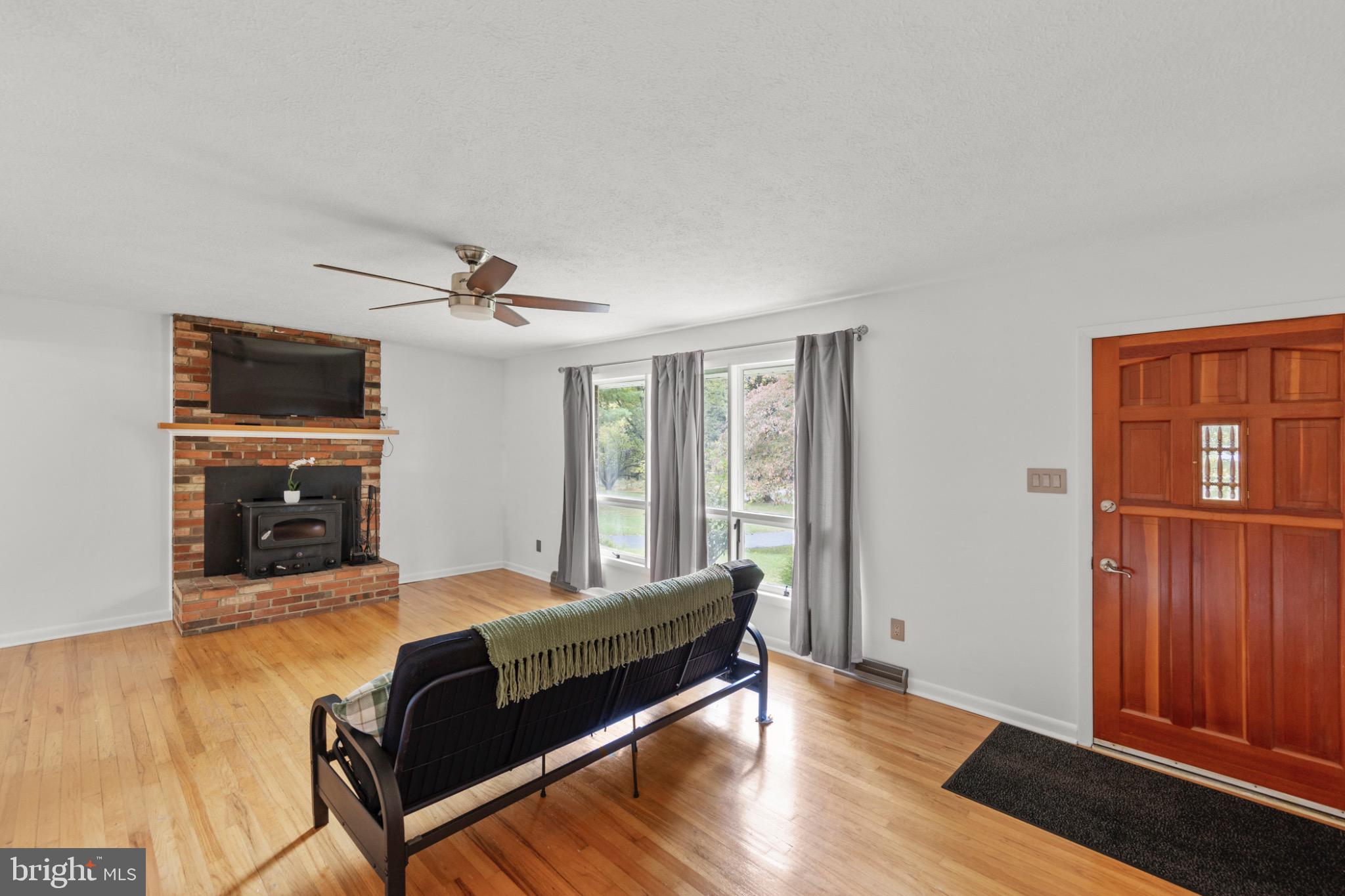 411 Rest Church Road Winchester, VA 22603 - Photo 7 of 46 Cozy living space with inviting warmth.