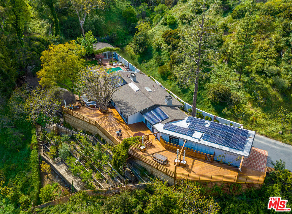 2131 Roscomare Road Los Angeles, CA 90077 - Photo 1 of 1 an aerial view of a house with a garden