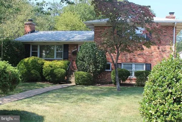 a view of a house with garden and plants