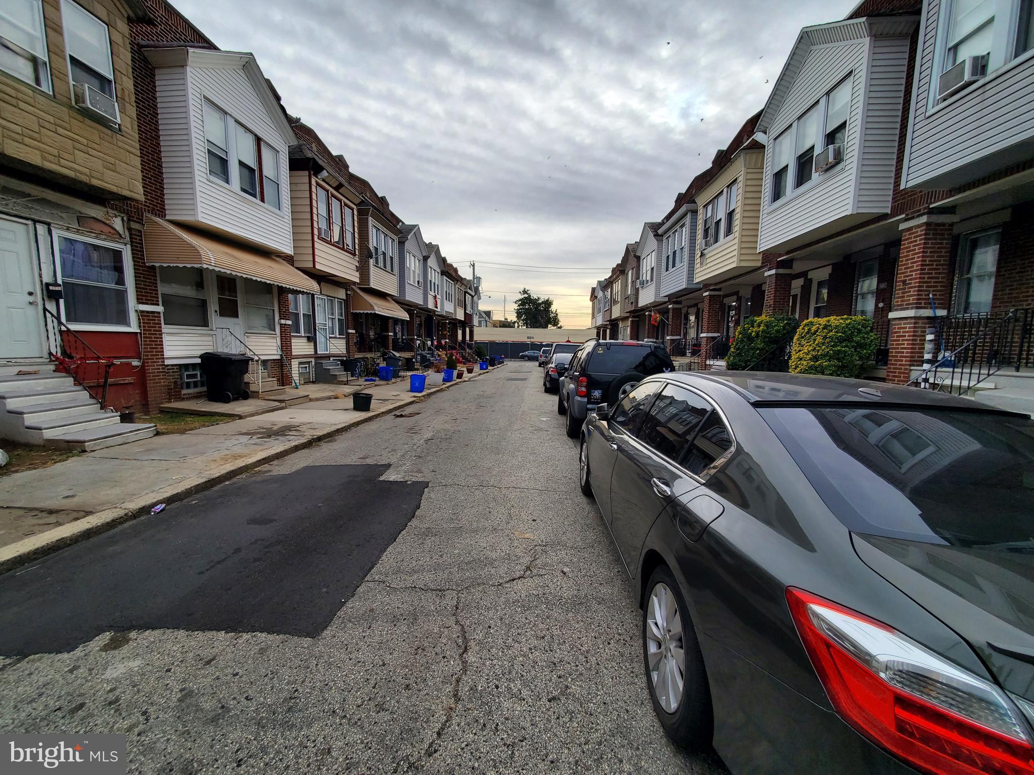 2130 Anchor Street Philadelphia, PA 19124 - Photo 3 of 23 a city street lined with buildings and cars