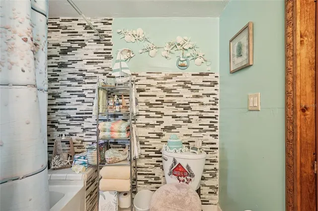 a bathroom with a shower and a sink