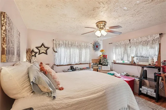 a bed room with a bed and a chandelier