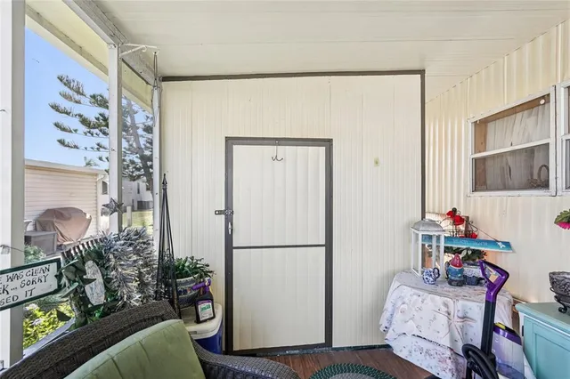 a entryway with furniture and wooden floor