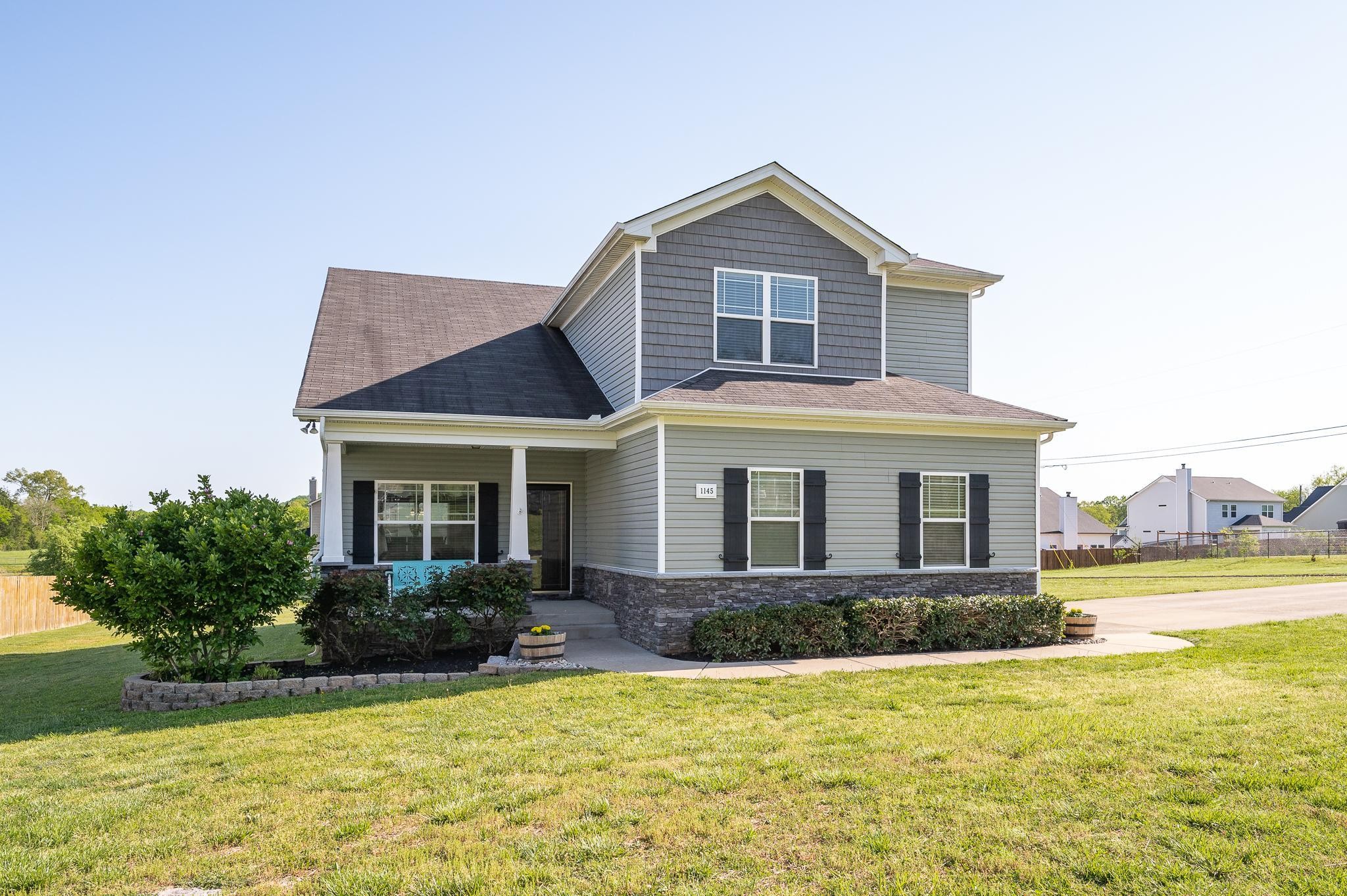 1145 Starhurst Drive Murfreesboro, TN 37128 - Photo 1 of 27 a front view of a house with a yard