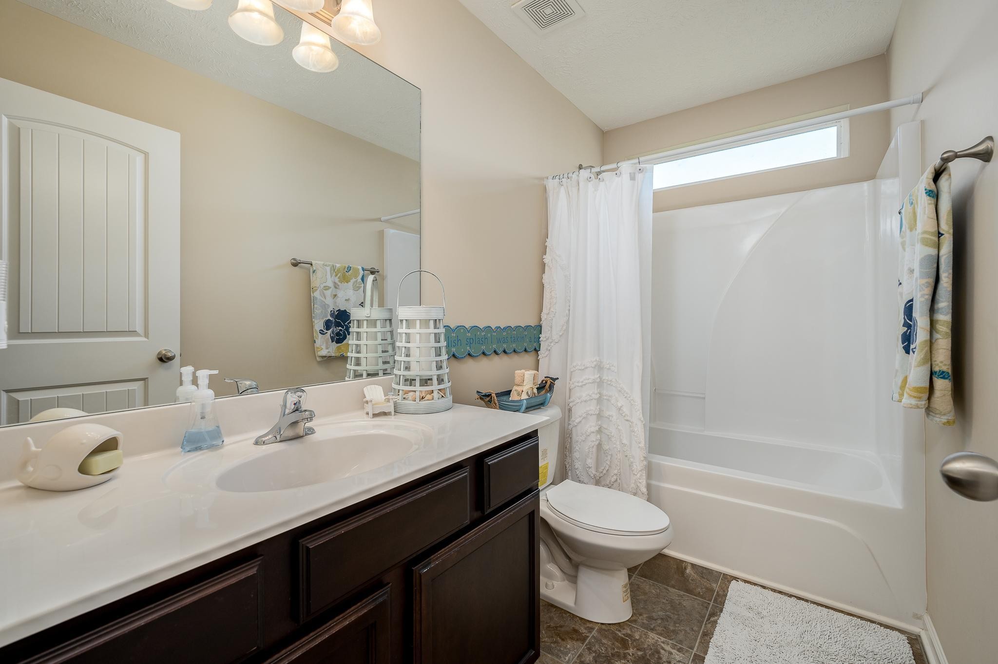 1145 Starhurst Drive Murfreesboro, TN 37128 - Photo 17 of 27 a bathroom with a sink a toilet and shower