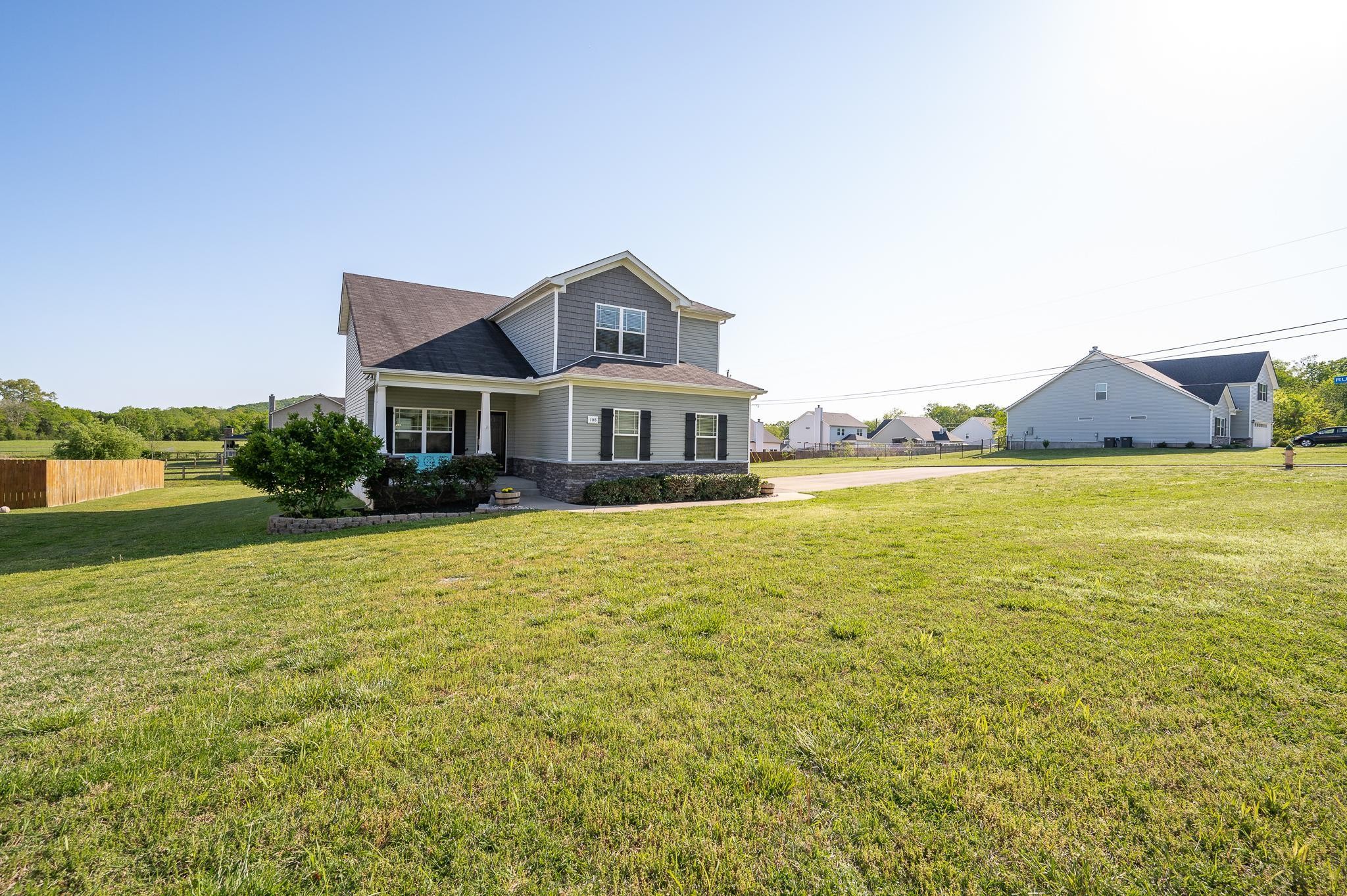 1145 Starhurst Drive Murfreesboro, TN 37128 - Photo 27 of 27 a front view of a house with a garden and lake view
