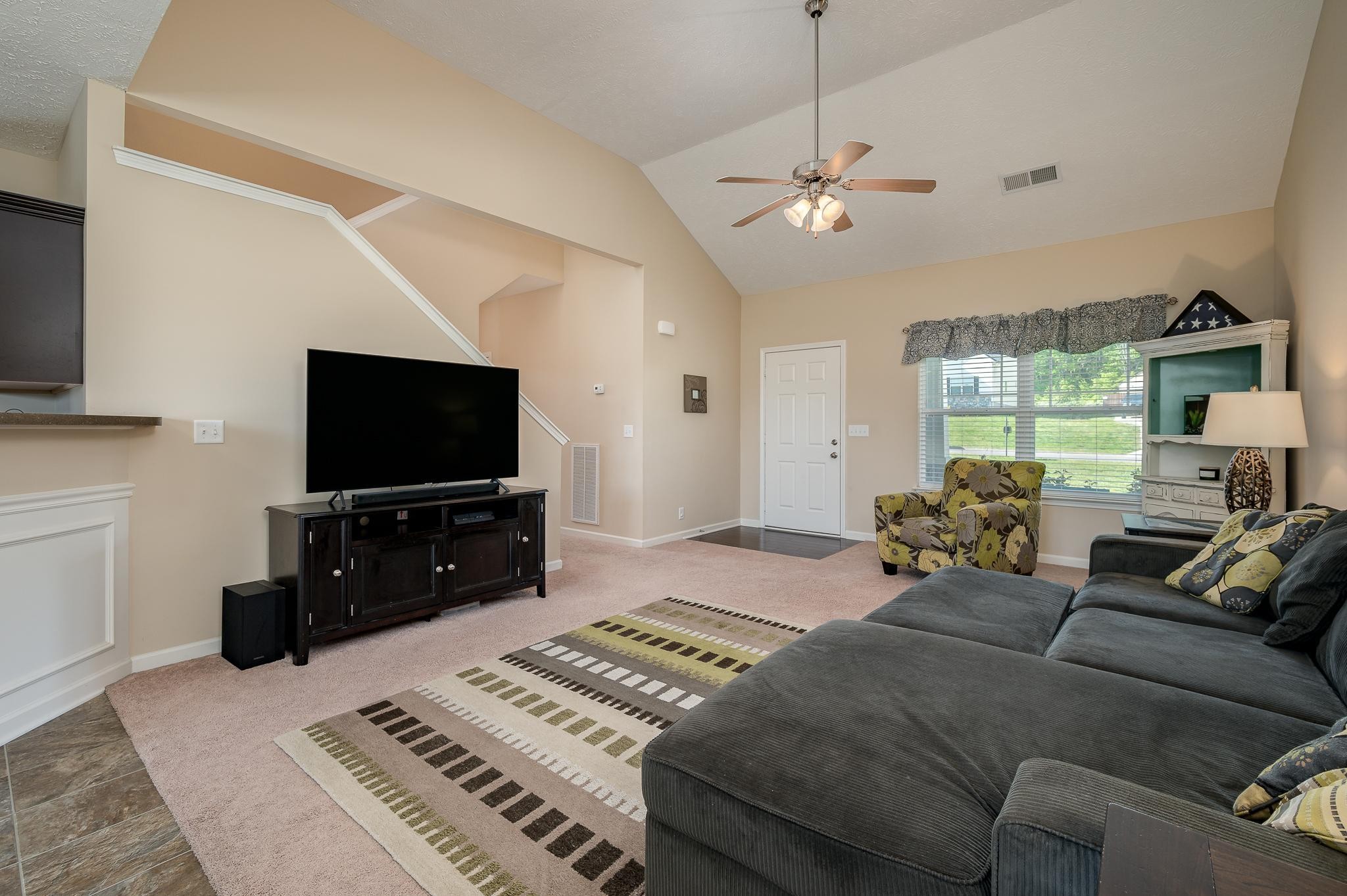 1145 Starhurst Drive Murfreesboro, TN 37128 - Photo 3 of 27 a bedroom with furniture and a flat screen tv