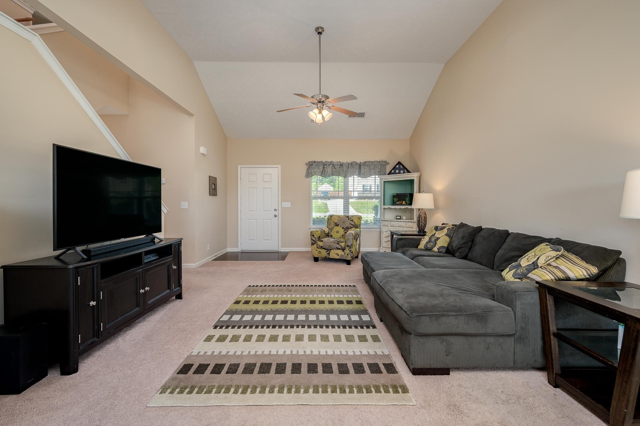 1145 Starhurst Drive Murfreesboro, TN 37128 - Photo 4 of 27 a living room with furniture and a flat screen tv