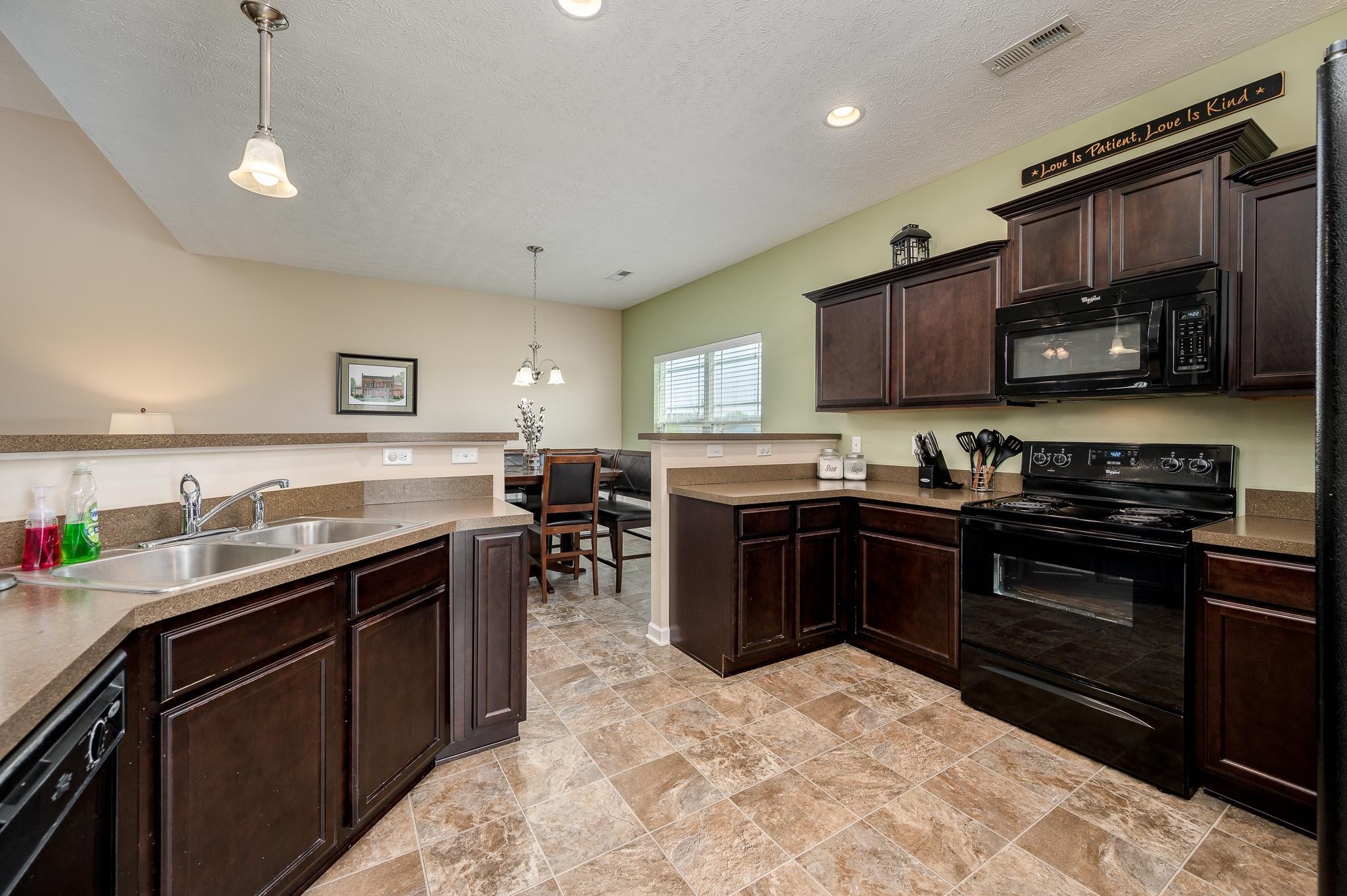 1145 Starhurst Drive Murfreesboro, TN 37128 - Photo 6 of 27 a kitchen with a sink stove and microwave