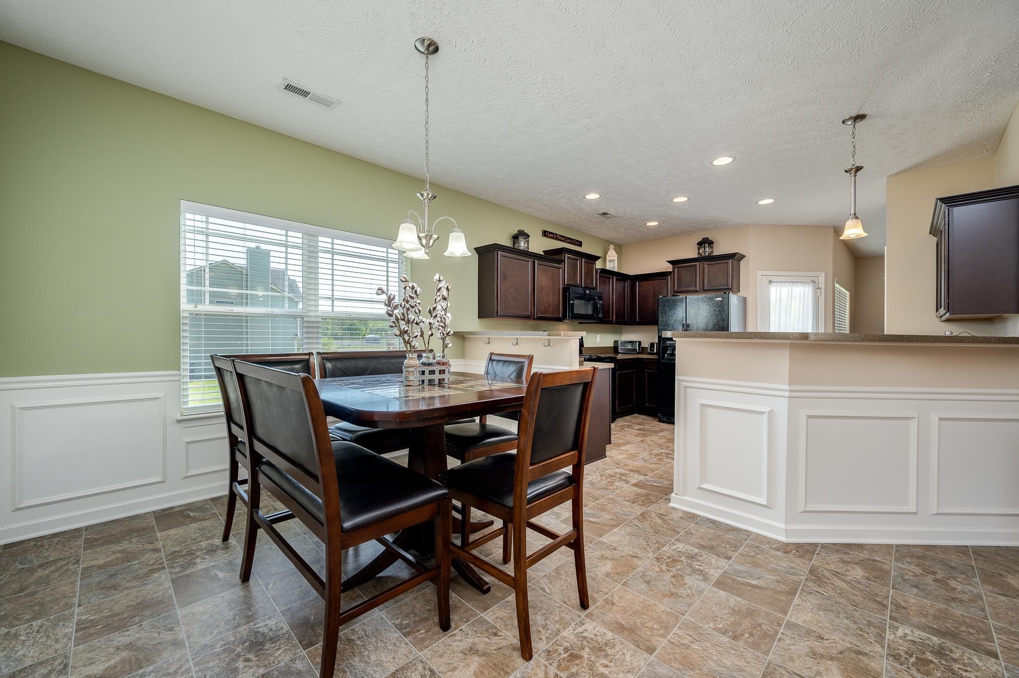 1145 Starhurst Drive Murfreesboro, TN 37128 - Photo 7 of 27 a kitchen with a table and chairs in it