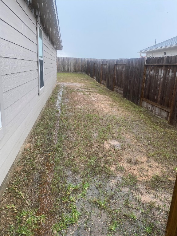 17768 Lion Heart Road Conroe, TX 77306 - Photo 11 of 11 a view of backyard with wooden fence