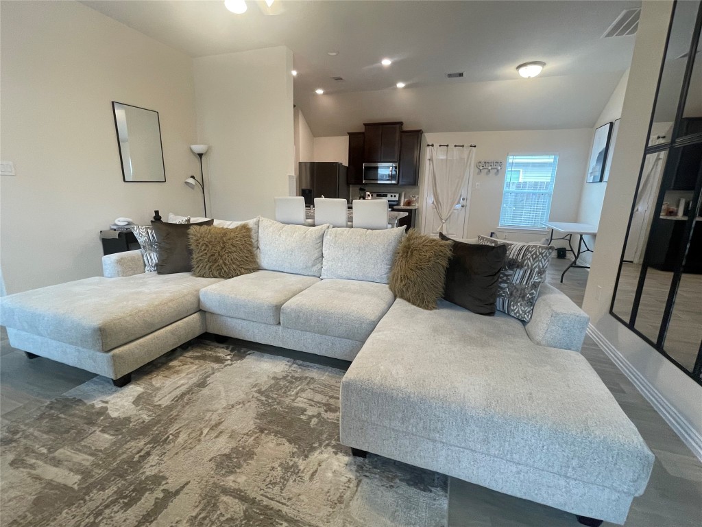 17768 Lion Heart Road Conroe, TX 77306 - Photo 3 of 11 a living room with furniture and a couch