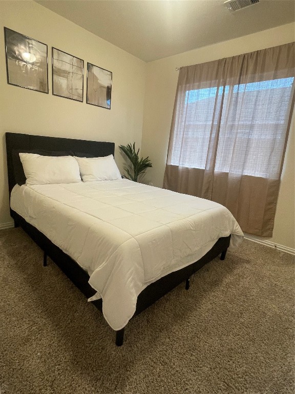 17768 Lion Heart Road Conroe, TX 77306 - Photo 6 of 11 a bedroom with a bed and window
