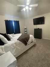 17768 Lion Heart Road Conroe, TX 77306 - Photo 7 of 11 a bedroom with a bed and a flat screen tv