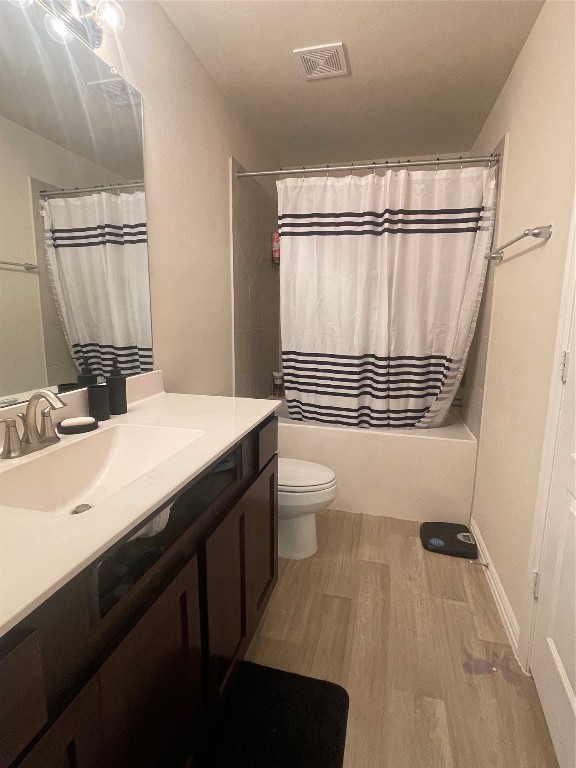 17768 Lion Heart Road Conroe, TX 77306 - Photo 9 of 11 a bathroom with a sink a toilet a mirror and shower