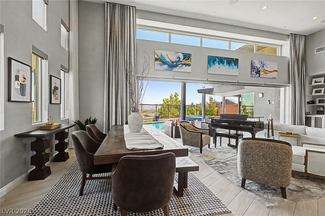 6014 Willow Ridge Court Las Vegas, NV 89135 - Photo 26 of 99 This expansive great room offers seamless indoor-outdoor living, with direct access to a private pool and scenic views.