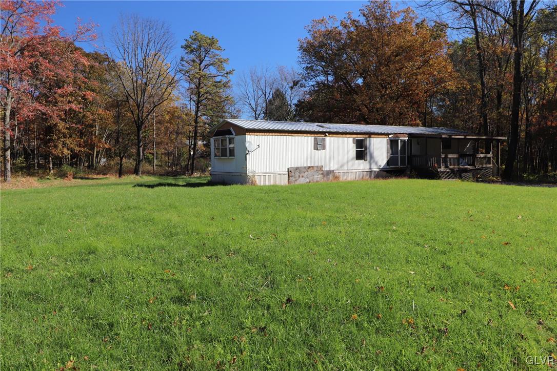 8427 Rextown Road Slatington, PA 18080 - Photo 3 of 13 a view of a backyard with large trees