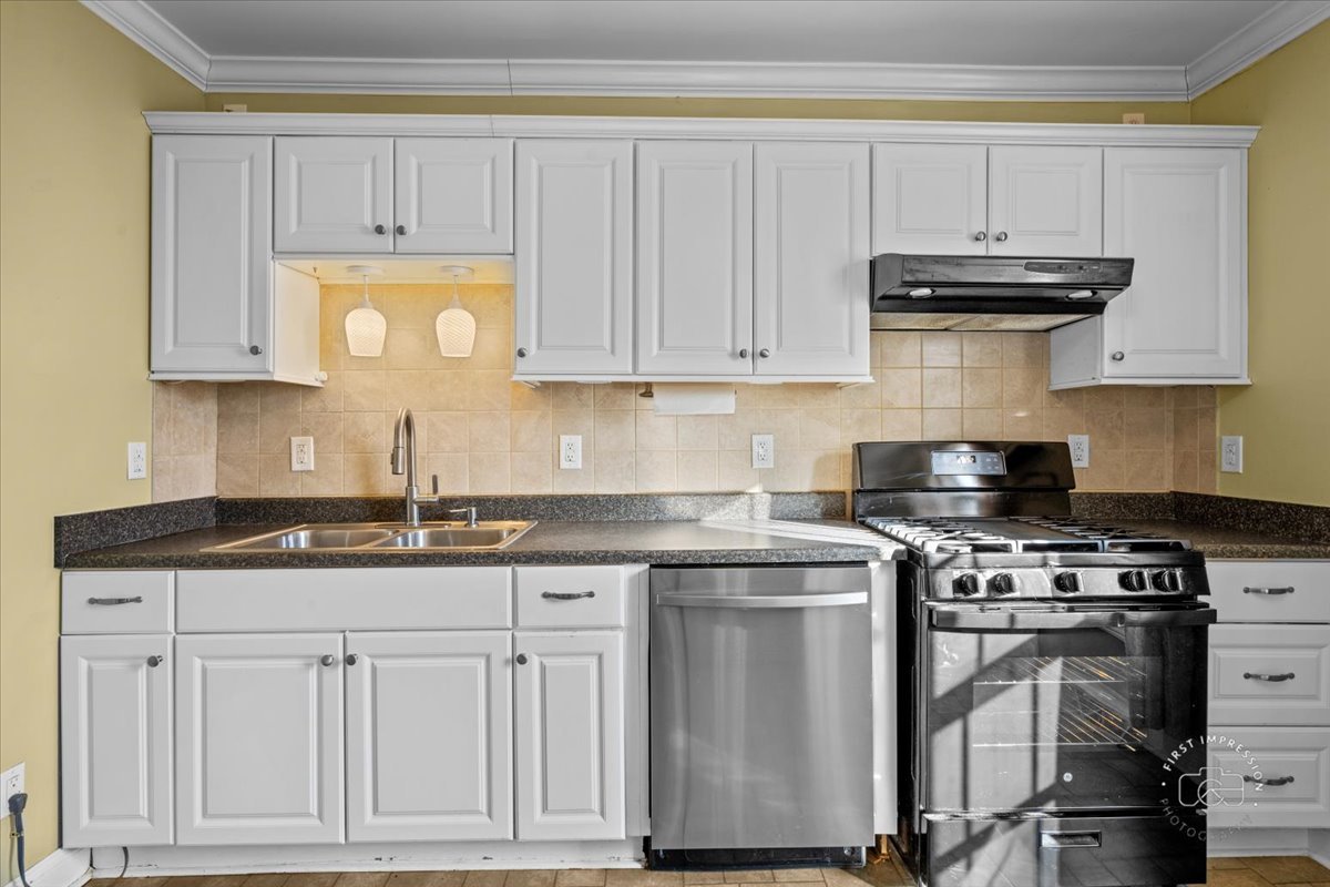 5N638 Hanson Road St. Charles, IL 60175 - Photo 14 of 31 a kitchen with granite countertop a sink stove and cabinets
