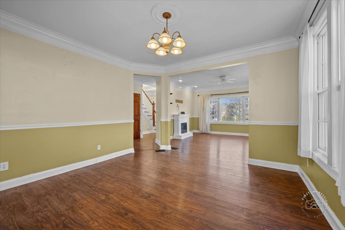 5N638 Hanson Road St. Charles, IL 60175 - Photo 8 of 31 a view of an empty room with wooden floor and a window