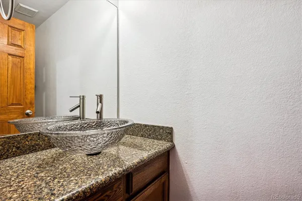 a bathroom with a sink and a window