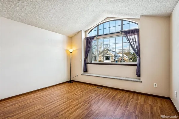a view of a livingroom with wooden floor