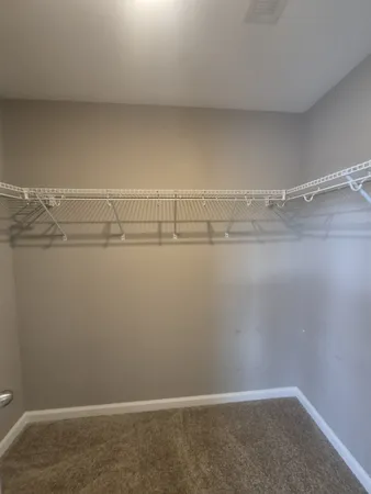 a view of a room with racks on the wall