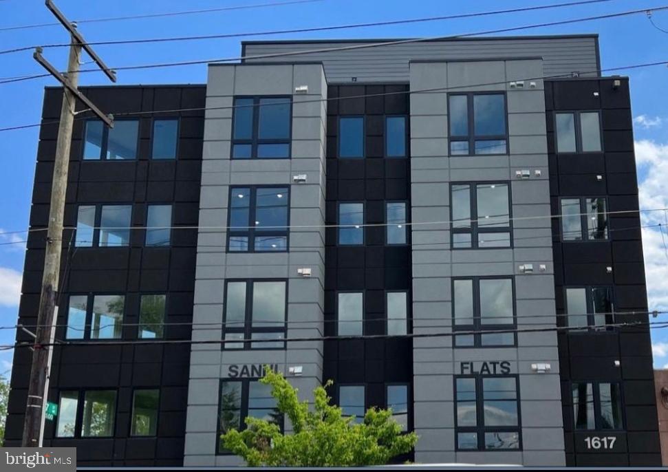 1617 Rhode Island Avenue Northeast, Unit 501 Washington, DC 20018 - Photo 1 of 17 a front view of a building with glass windows