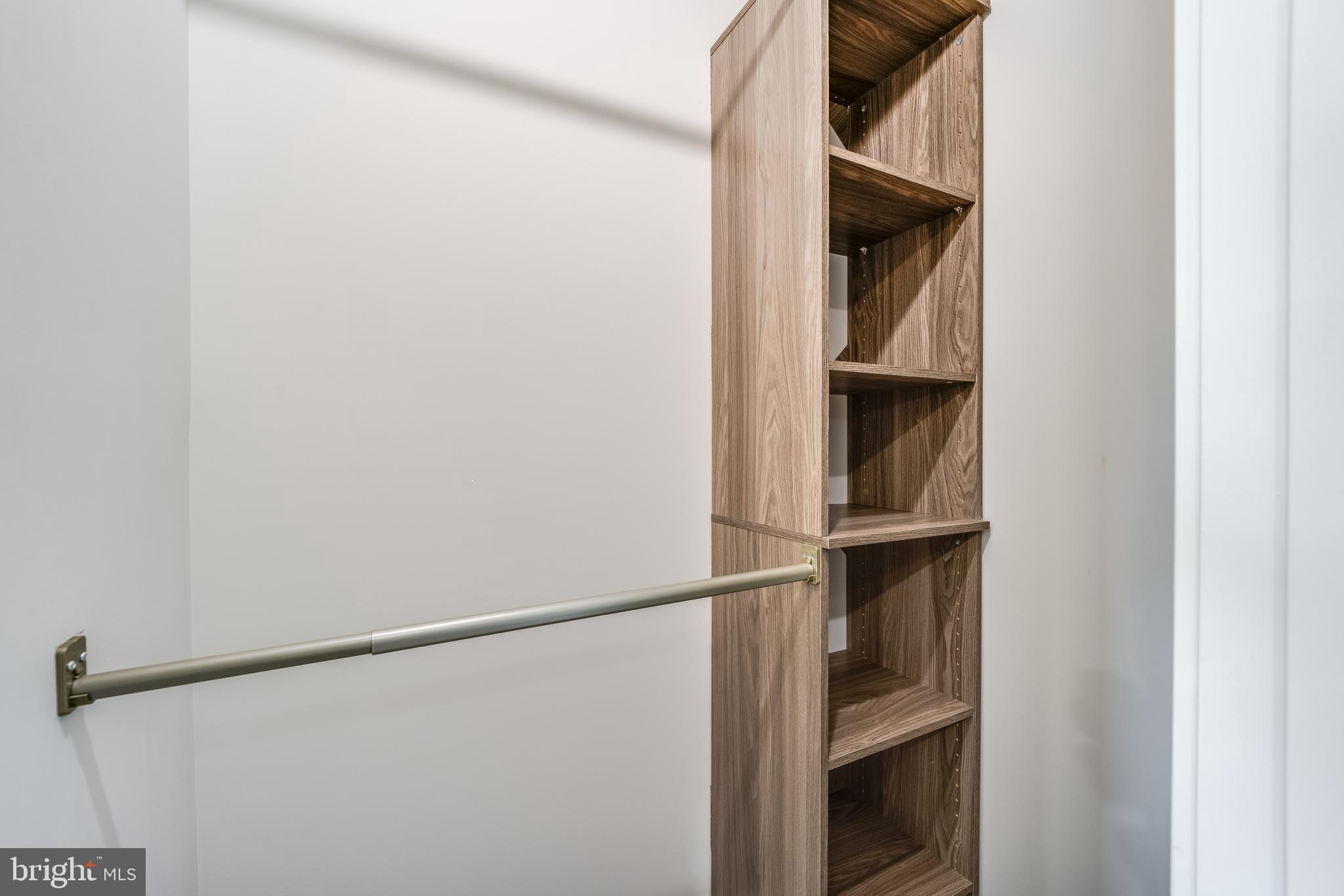 1617 Rhode Island Avenue Northeast, Unit 501 Washington, DC 20018 - Photo 13 of 17 a view of walk in closet with clothes and shoes