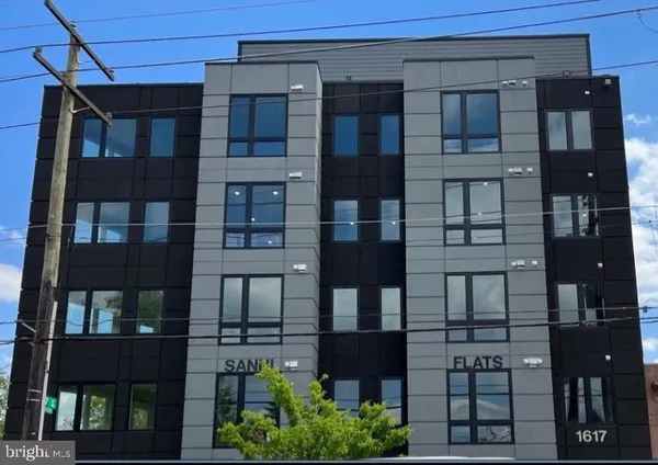 a front view of a building with glass windows
