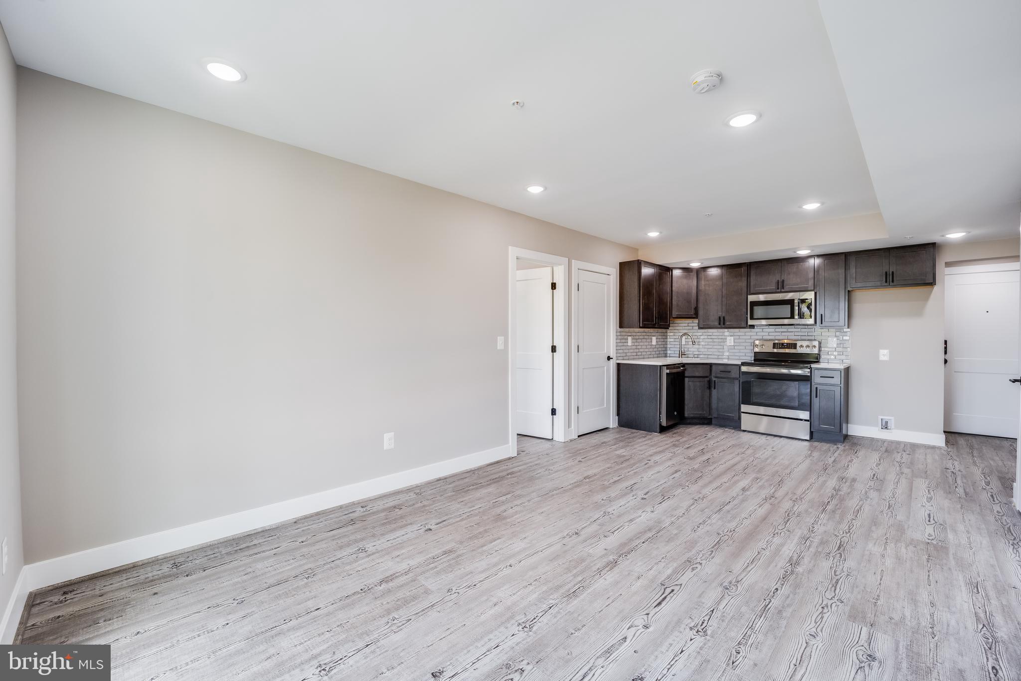 1617 Rhode Island Avenue Northeast, Unit 501 Washington, DC 20018 - Photo 5 of 17 a view of kitchen with wooden floor
