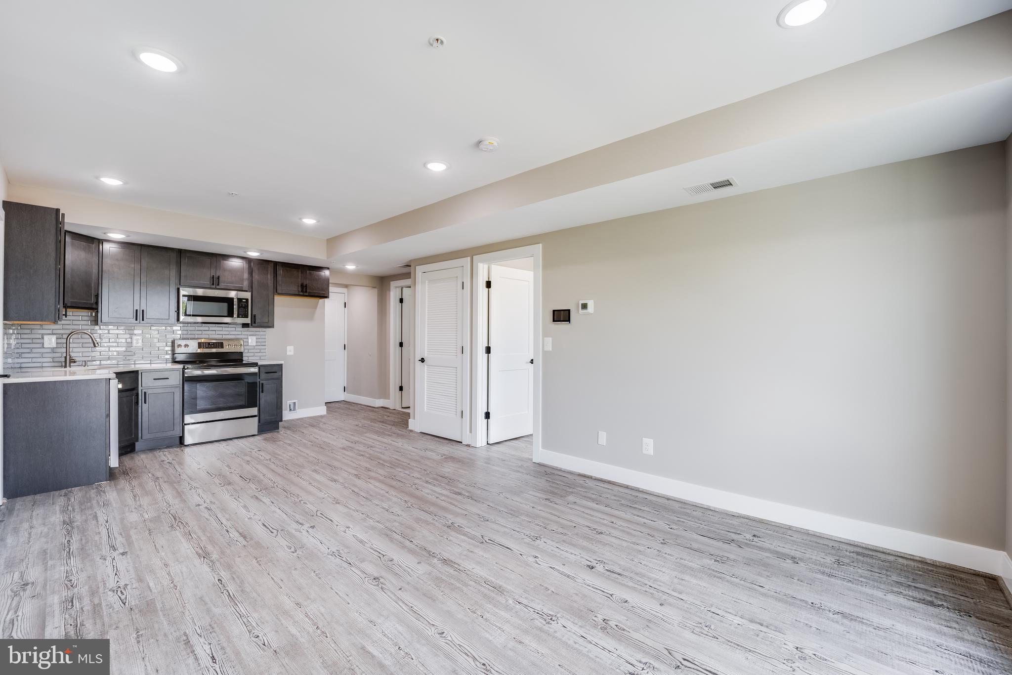1617 Rhode Island Avenue Northeast, Unit 501 Washington, DC 20018 - Photo 6 of 17 a view of kitchen with wooden floor