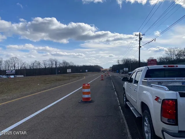a view of car parked on the road
