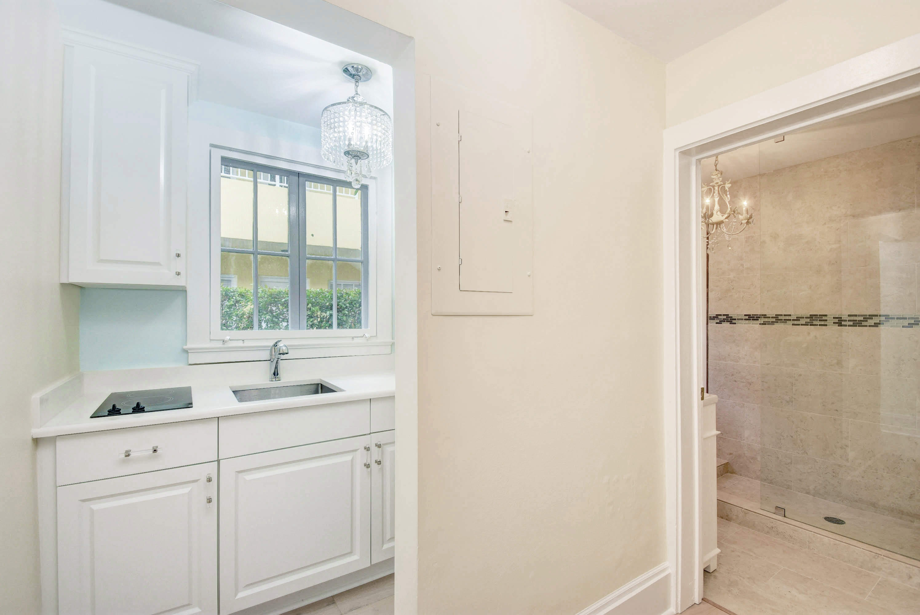 301 Chilean Avenue, Unit 80 Palm Beach, FL 33480 - Photo 12 of 20 a kitchen with a sink and cabinets