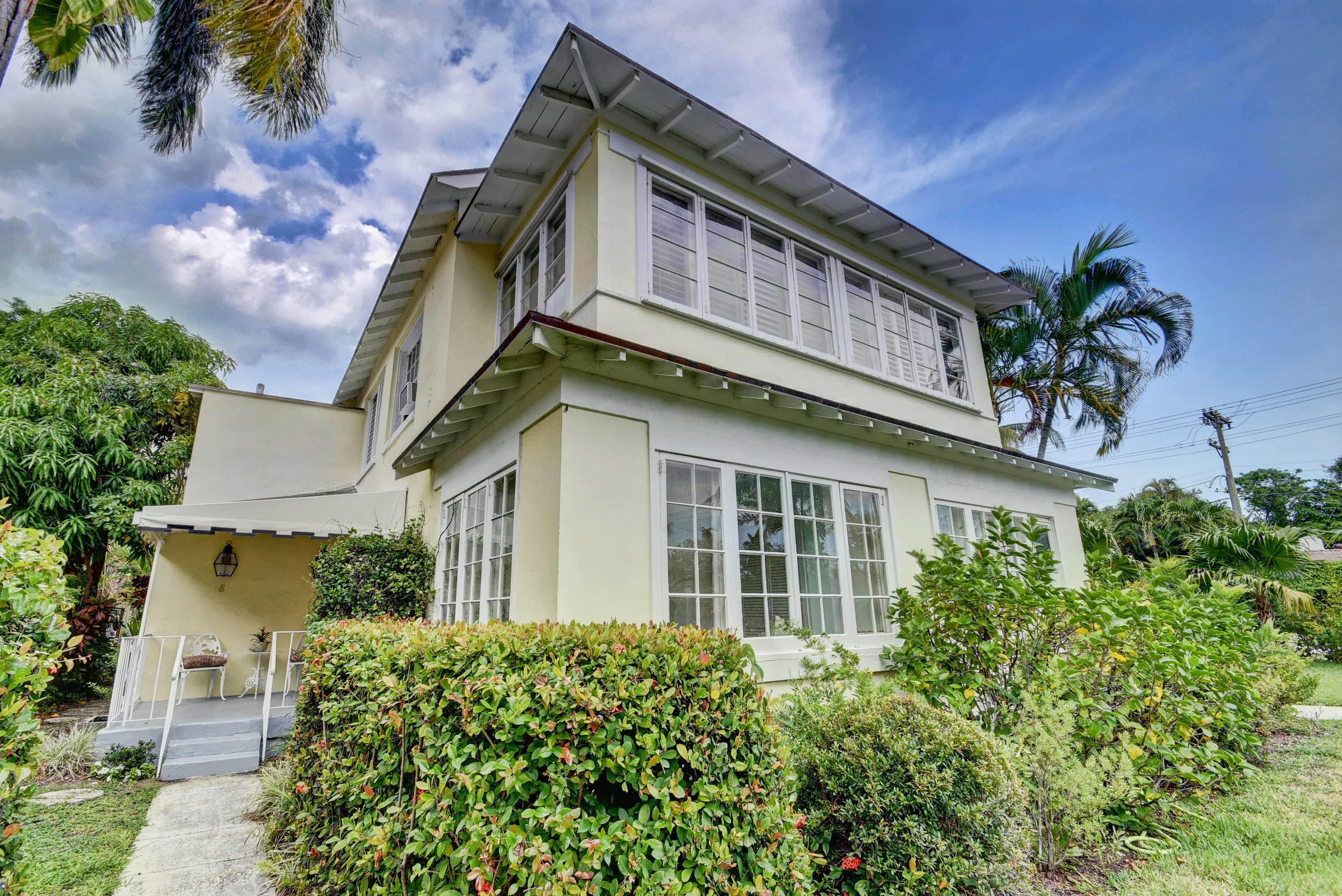 301 Chilean Avenue, Unit 80 Palm Beach, FL 33480 - Photo 3 of 20 front view of a house with potted plants