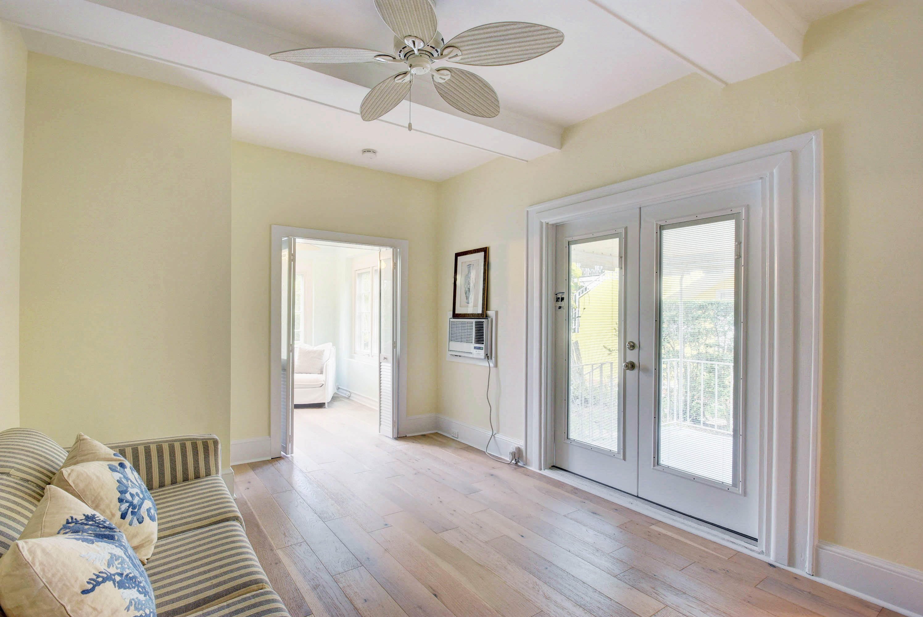 301 Chilean Avenue, Unit 80 Palm Beach, FL 33480 - Photo 7 of 20 a view of a livingroom with wooden floor and a ceiling fan
