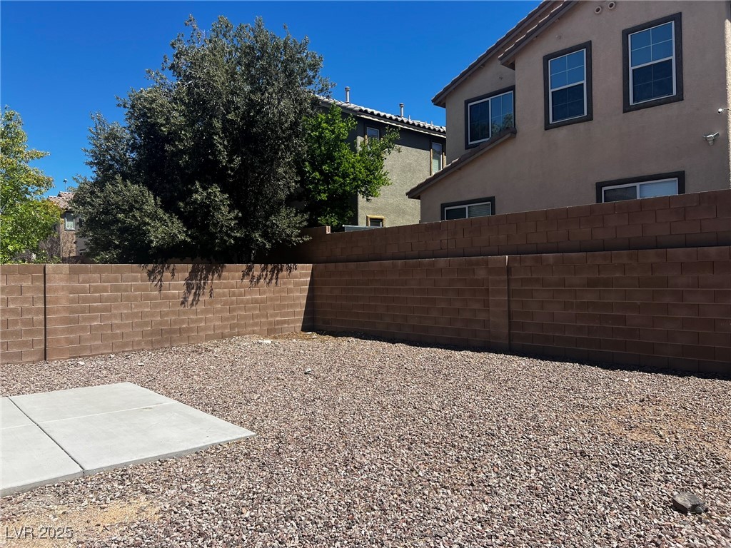 3153 Amari Avenue Las Vegas, NV 89141 - Photo 11 of 21 Fenced backyard with a patio area