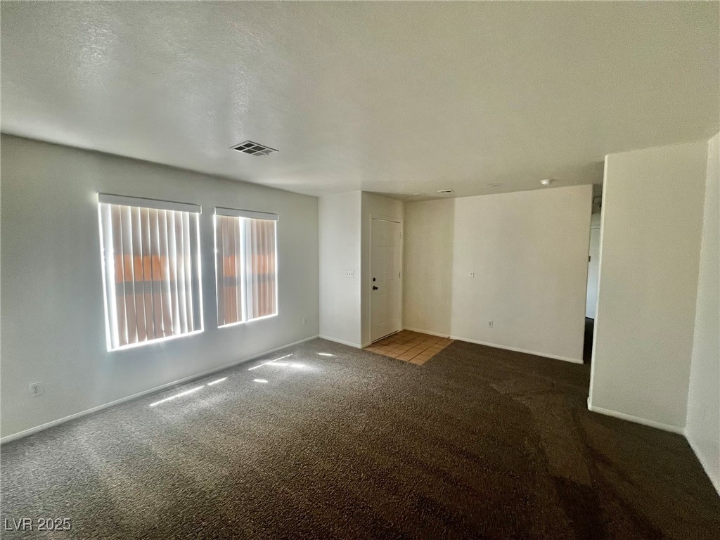 3153 Amari Avenue Las Vegas, NV 89141 - Photo 4 of 21 Empty room featuring carpet flooring and baseboards