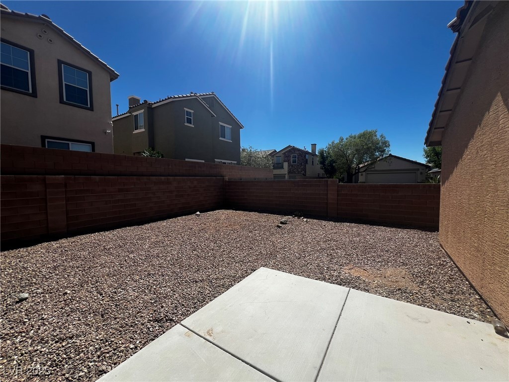 3153 Amari Avenue Las Vegas, NV 89141 - Photo 10 of 21 Fenced backyard with a patio and a residential view