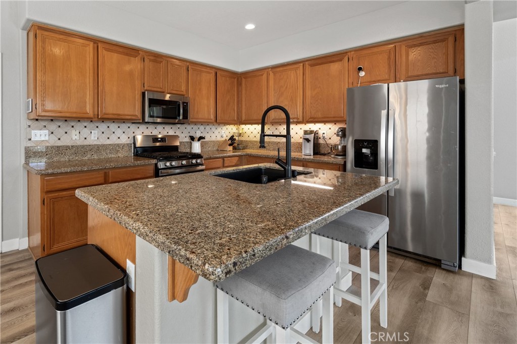 32985 Novara Court Temecula, CA 92592 - Photo 15 of 56 Kitchen Featuring Granite Countertops And Stainless Steel Appliances