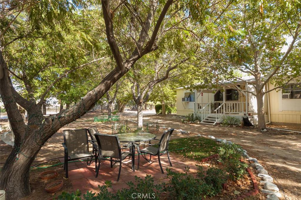 31181 Bullrush Road Lucerne Valley, CA 92356 - Photo 1 of 1 a view of a yard with table and chairs