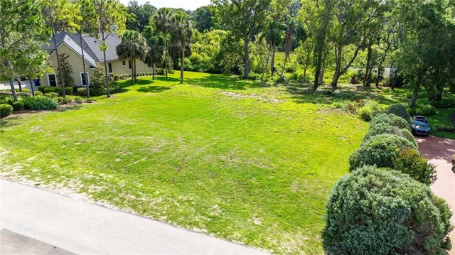 a view of yard with swimming pool and green space