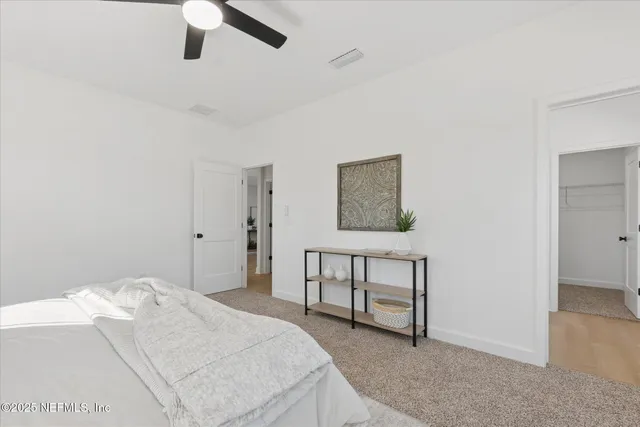 a bedroom with a bed and a cabinets