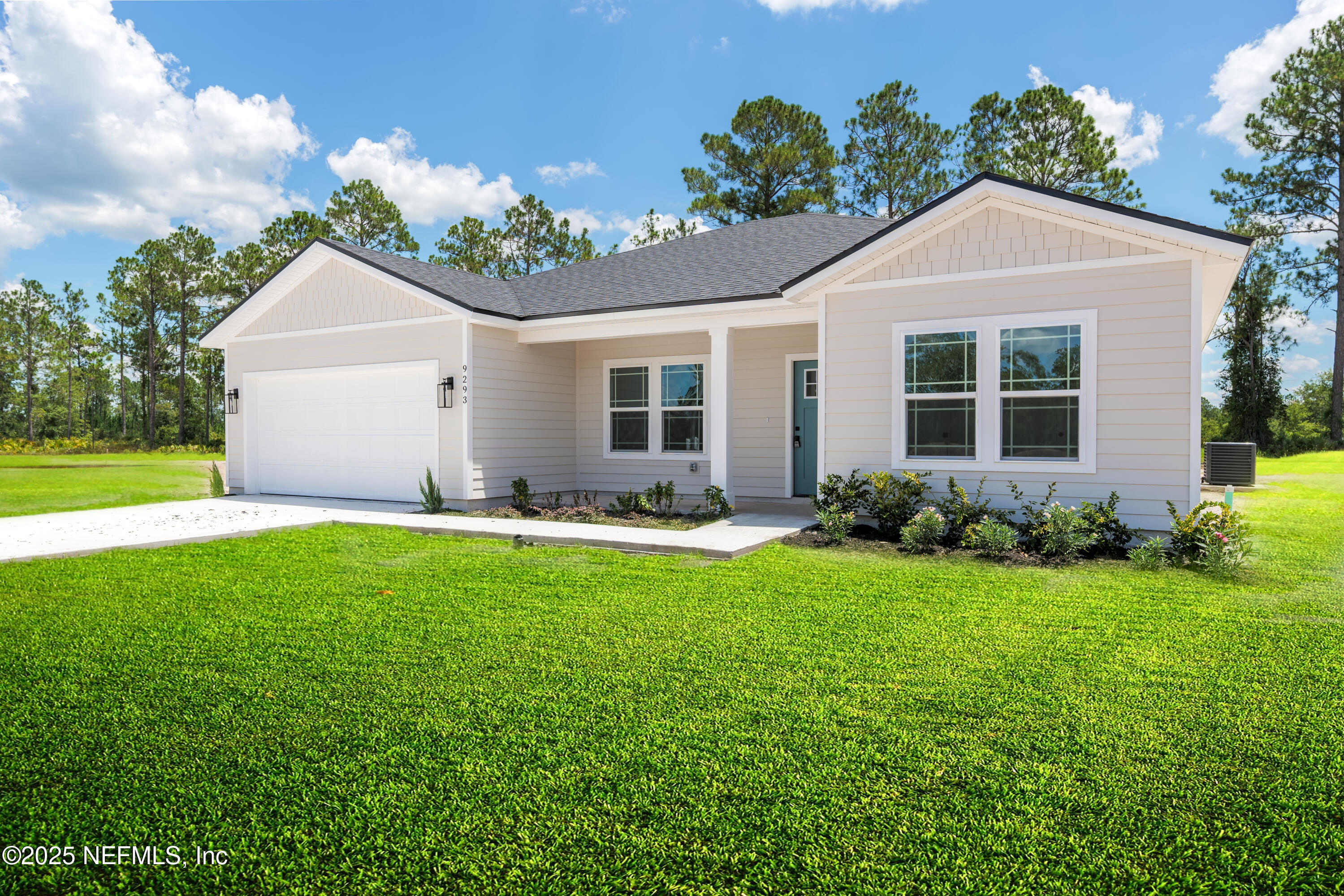 9293 Dolphin Street Sanderson, FL 32087 - Photo 2 of 29 a front view of house with yard and green space