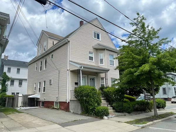 a front view of a house with yard