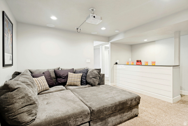 983 West 1550th Street South Springville, UT 84663 - Photo 41 of 43 Recessed ceiling lighting illuminates a media area featuring a ceiling-mounted projector and integrated ceiling speakers.