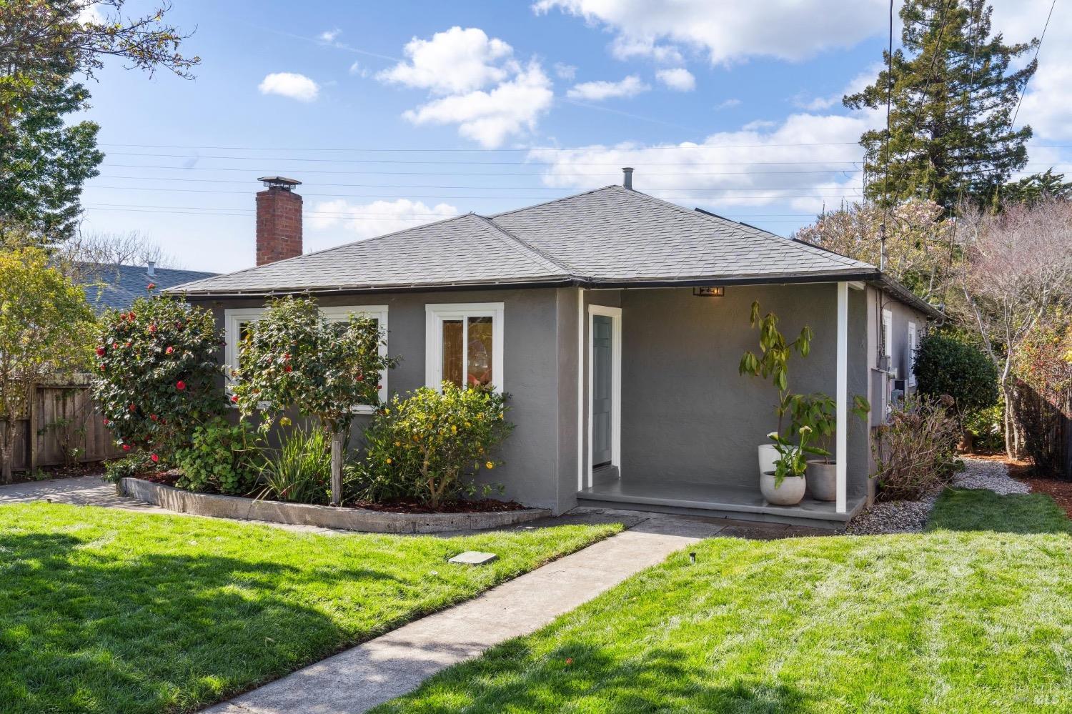 a front view of a house with garden